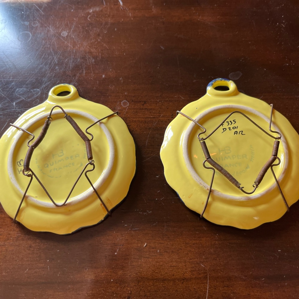 Quimper hanging plates.  Soleil patters about 4” across